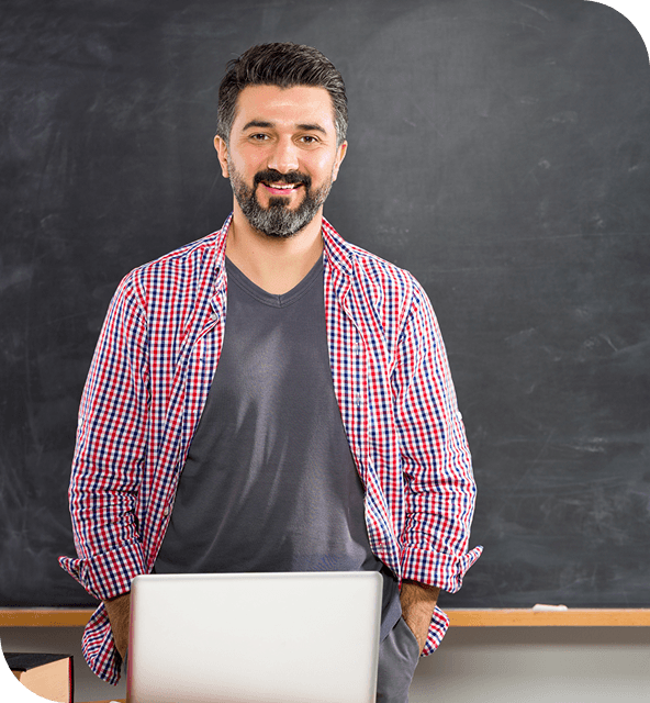 Teacher with dark chalkboard background